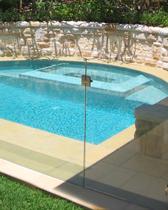 Glass fencing around a Total Concept inground spa and splash pool