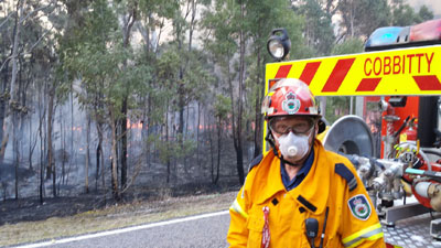 Swimming pool and spa industry member Peter Rabbidge fighting a bushfire at Londonderry