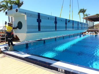 One of the bulkheads being lowered into place