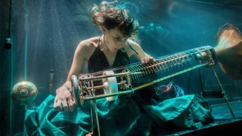 Nanna Bech of Aquasonic performing in an aquarium. Photo Credit: Charlotta de Miranda