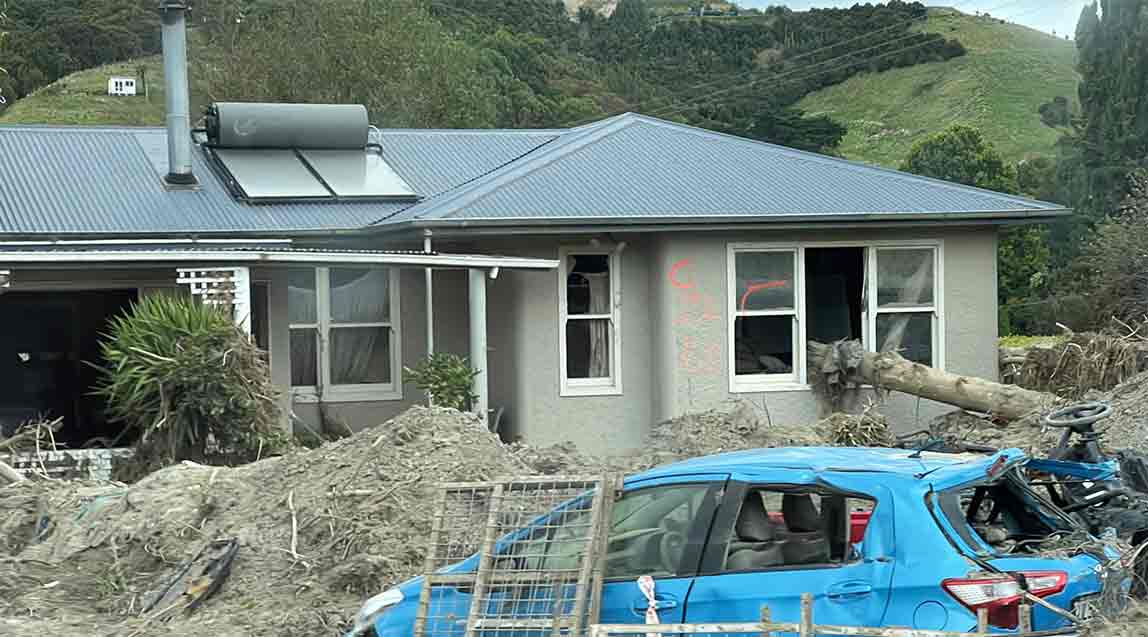 Many homes were destroyed or badly damaged, this one has a tree through the window